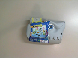 A toy shark, a set of marine animal figurines