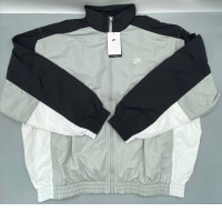 Men's oversized woven warm-up jacket from Nike Club in light smoke grey/black/white. Men's oversized woven warm-up jacket from Nike Club in light smoke grey/black/white.