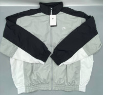 Men's oversized woven warm-up jacket from Nike Club in light smoke grey/black/white.