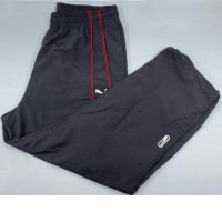 PUMA PUMATECH Relaxed Track Pants in the "Puma Black-For All Time Red" colorway. PUMA PUMATECH Relaxed Track Pants in the "Puma Black-For All Time Red" colorway.