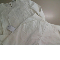 Women's white suit, blouse and shorts
