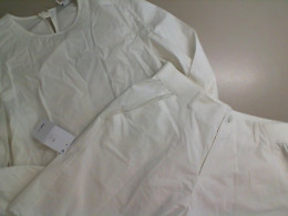 Women's white suit, blouse and shorts Women's white suit, blouse and shorts