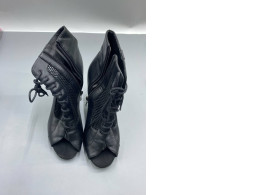 Black high-heeled boots for women.