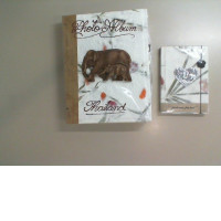 A photo album and notebook set with an image of an elephant