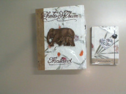 A photo album and notebook set with an image of an elephant