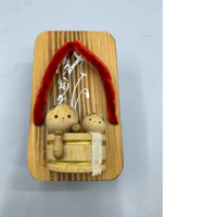 vintage Japanese collectible features two small wooden Kokeshi dolls sitting inside a wooden tub, all mounted on a traditional Geta sandal base. vintage Japanese collectible features two small wooden Kokeshi dolls sitting inside a wooden tub, all mounted on a traditional Geta sandal base.