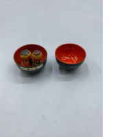  vintage Japanese Kokeshi dolls housed in traditional lidded bowls. 