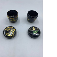 Set of 2 Japanese lacquered tea boxes, known as Natsume, feature traditional gold-colored maki-e lacquer patterns and are typically used in tea ceremonies to hold matcha green tea powder.