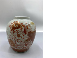 Japanese Kutani ware porcelain vase featuring a red and gold hand-painted design of a peacock amidst peonies. 