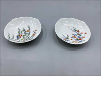 Set of 2 An antique Japanese porcelain plate, believed to be of Kutani porcelain, featuring intricately hand-painted floral patterns.