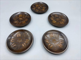 Set of 5 vintage Japanese Kamakura-bori carved wood lacquerware plates or trays featuring a camellia flower motif. Set of 5 vintage Japanese Kamakura-bori carved wood lacquerware plates or trays featuring a camellia flower motif.