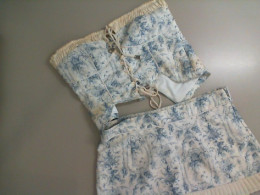 Women's suit, top + skirt-shorts