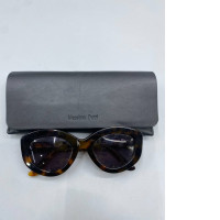 Fashionable women's sunglasses and a black glasses case.