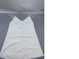 white sleeveless mini dress featuring a sweetheart neckline and adjustable tie straps. white sleeveless mini dress featuring a sweetheart neckline and adjustable tie straps.