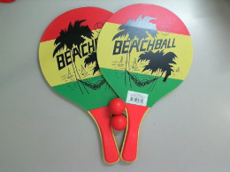 A set of wooden rackets + 2 balls