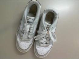 Gray women's sneakers with a pink stripe