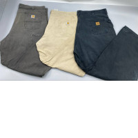 Set of 3 Vintage Carhartt work trousers in moss green, beige, and dark gray.
