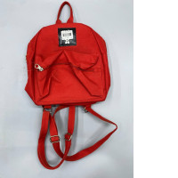 The red backpack appears to be of a casual style.