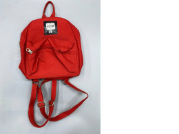 The red backpack appears to be of a casual style.