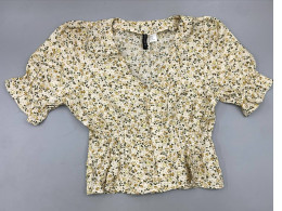 This floral print peplum blouse from H&M features a V-neck and short, puffy sleeves.