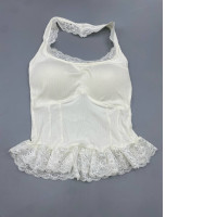 White camisole top with a halter neck design, featuring lace trim and ruffled hem.
