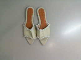 Women's light-colored open-toe shoes