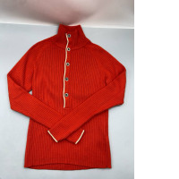  ribbed knit sweater featuring a button-down collar and contrasting trim.