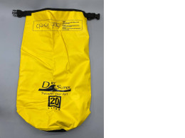 A 20-liter yellow Dry Super waterproof dry bag designed for outdoor activities like boating and camping A 20-liter yellow Dry Super waterproof dry bag designed for outdoor activities like boating and camping
