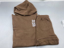 A long-sleeved hooded sweatshirt and long pants.