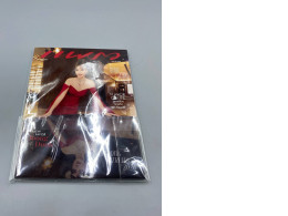 Thai magazine featuring a person in a red gown on the cover, dated for January-February 2026.