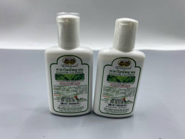 Set of 2 Abhaibhubejhr Payayor Calamine Lotion, a natural Thai herbal remedy used to soothe itchy and inflamed skin. 