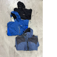 Set of 3 A vintage-style Gore-Tex waterproof jacket, similar to the Berghaus Mera Peak or Trango models, which were windbreakers for mountaineering in the 1990s.