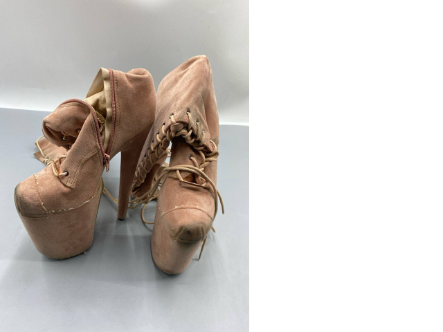 Pink suede lace-up high-heeled boots, similar to the Jeffrey Campbell Lita model. Pink suede lace-up high-heeled boots, similar to the Jeffrey Campbell Lita model.