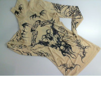 Beige turtleneck with black pattern Beige turtleneck with black pattern