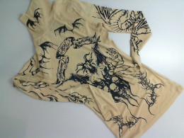 Beige turtleneck with black pattern Beige turtleneck with black pattern