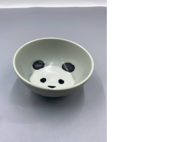 Hasami glass-glazed rice bowl with a black panda design. Hasami glass-glazed rice bowl with a black panda design.