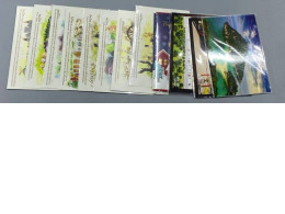 Set of 12 Postcards featuring tourist attractions on islands in Thailand.