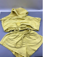yellow two-piece loungewear set featuring a cropped zip-up hoodie and matching sweatshorts. yellow two-piece loungewear set featuring a cropped zip-up hoodie and matching sweatshorts.