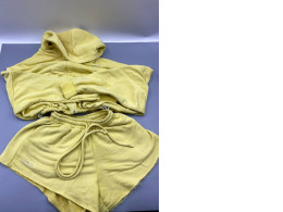 yellow two-piece loungewear set featuring a cropped zip-up hoodie and matching sweatshorts. 