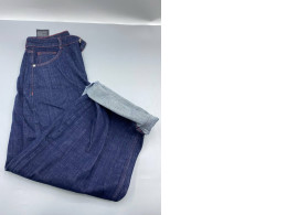 Dark indigo jeans, loose fit or wide leg.