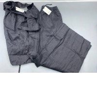 black linen wide-leg pants and matching top set by the brand Riye.