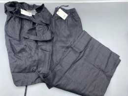 black linen wide-leg pants and matching top set by the brand Riye. black linen wide-leg pants and matching top set by the brand Riye.