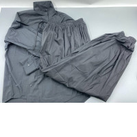 Loose-fitting black parachuting trousers.