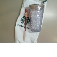 Plastic Starbucks cup with straw in a bag