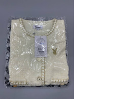 Women's cream tweed jacket by Playboy.