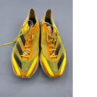 Adidas Adizero Adios 8 running shoes in the Spark Orange/Ivory/Black colorway 