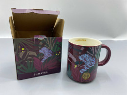 Starbucks Sumatra coffee mug featuring a jungle and tiger design.