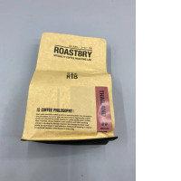 bag of medium-roast specialty coffee beans from ROAST8RY coffee roasting lab in Thailand. 
