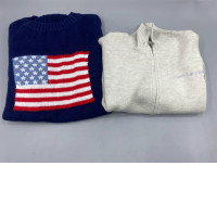 Set of 2 A blue crewneck sweater with an American flag design is on the left, and a light gray zip-up turtleneck sweater is also on the left.
