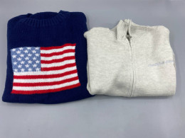 Set of 2 A blue crewneck sweater with an American flag design is on the left, and a light gray zip-up turtleneck sweater is also on the left.
